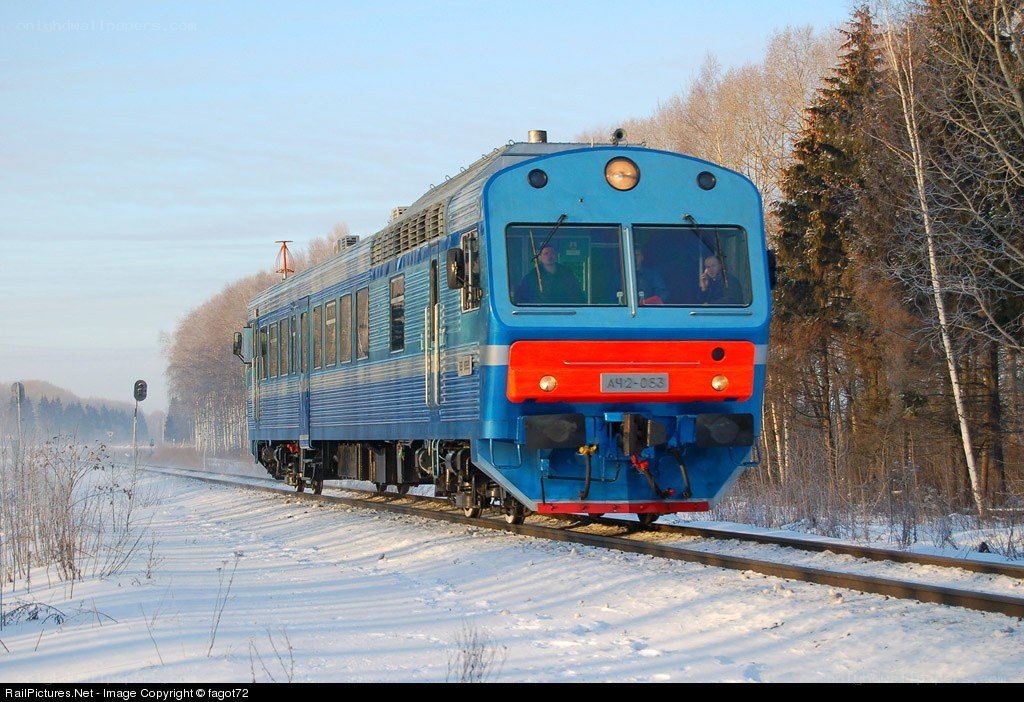 Blue train in winter landscape