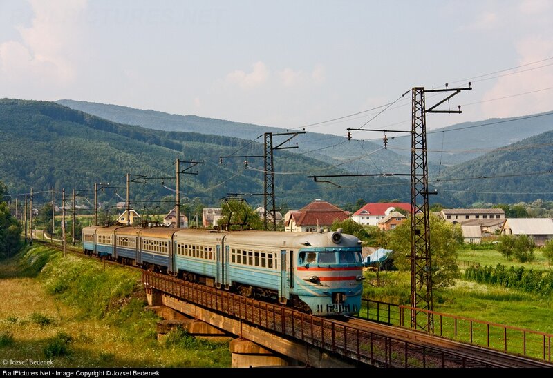 Blue train on a bridge