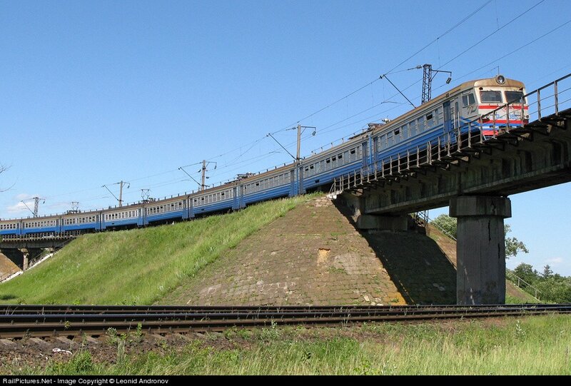 Blue Train on Bridge — Calm