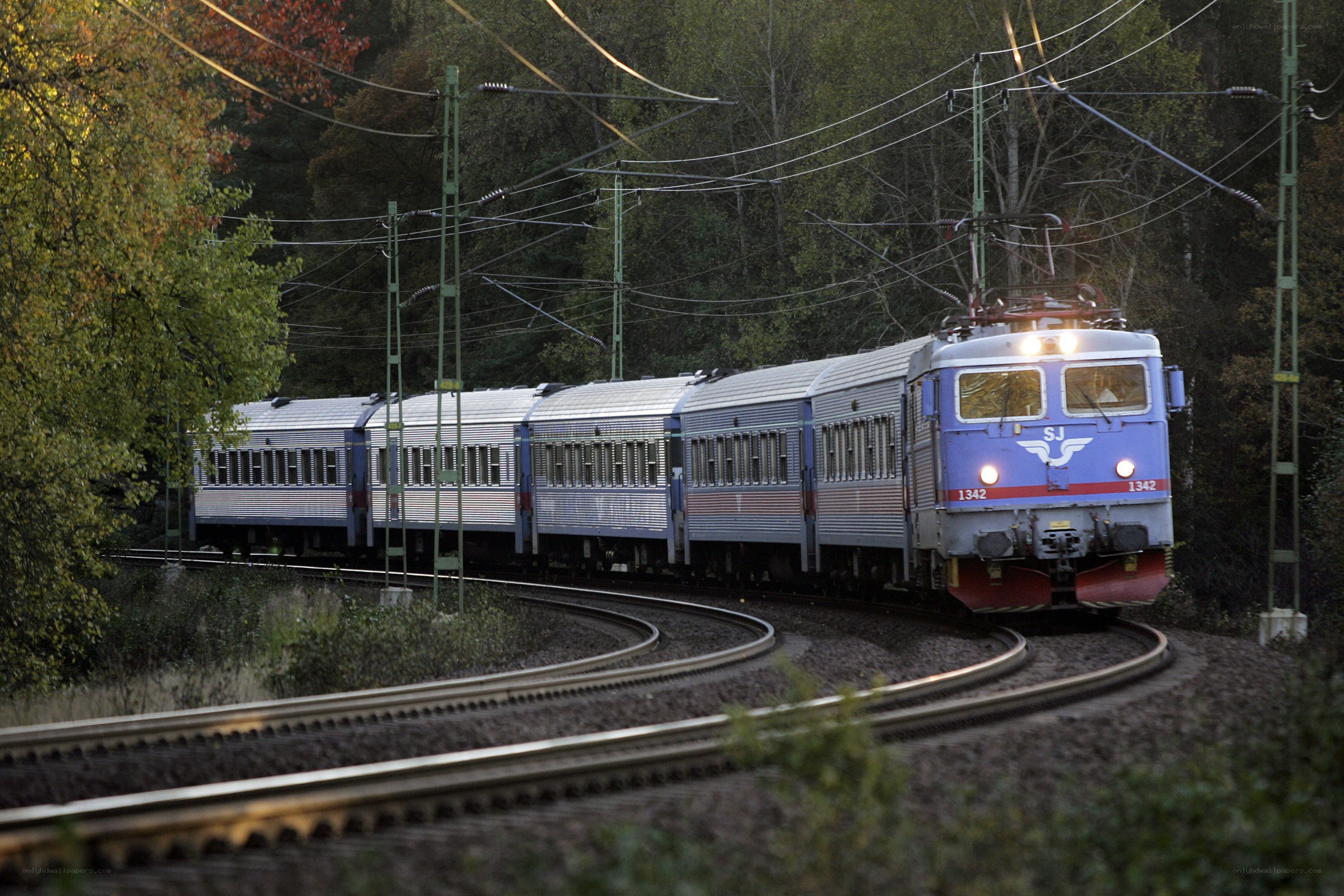 Blue train on curved tracks