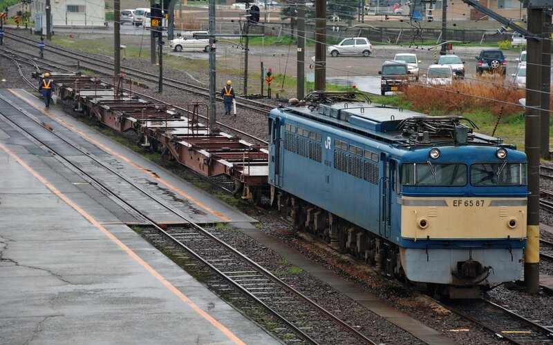 Blue train on railway tracks