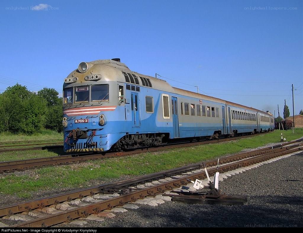 Blue train on railway tracks