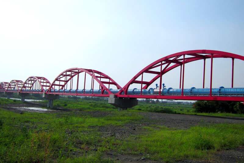 Blue Train on Red Bridge