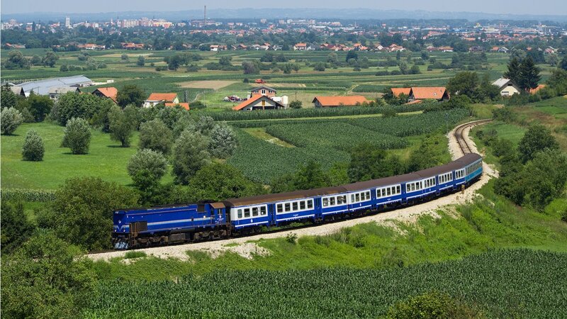 Blue Train on Track — Serene