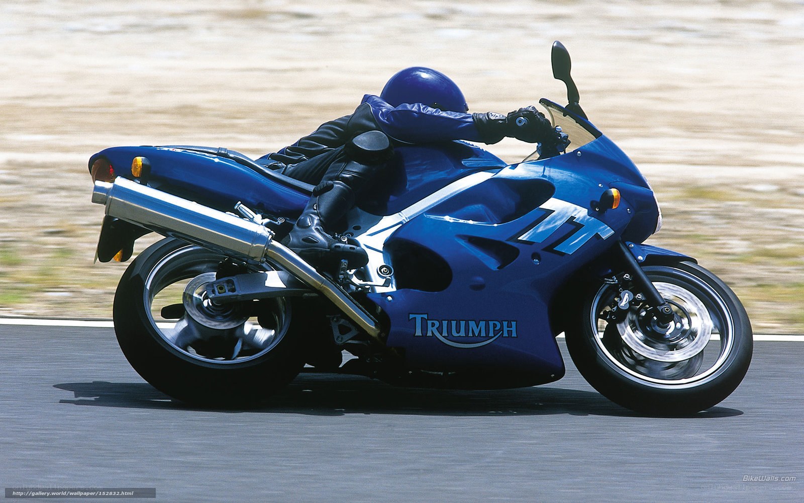 Blue Triumph motorcycle on track