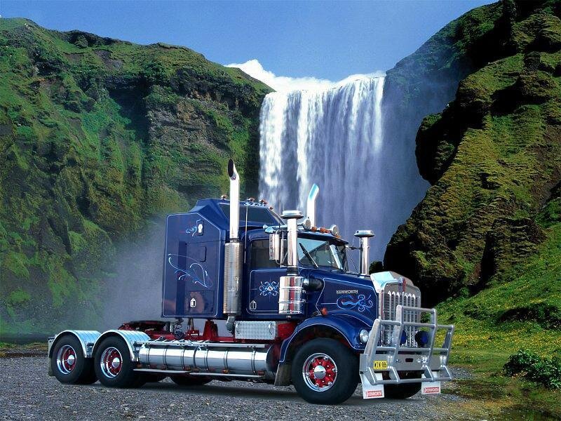 Blue truck near waterfall