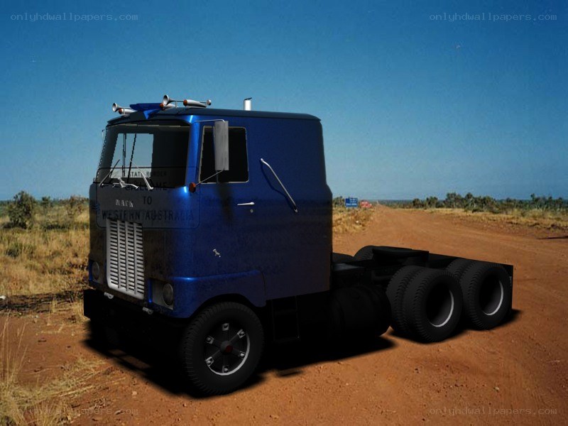 Blue truck on dirt road