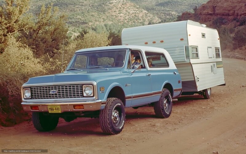 Blue truck with camper trailer