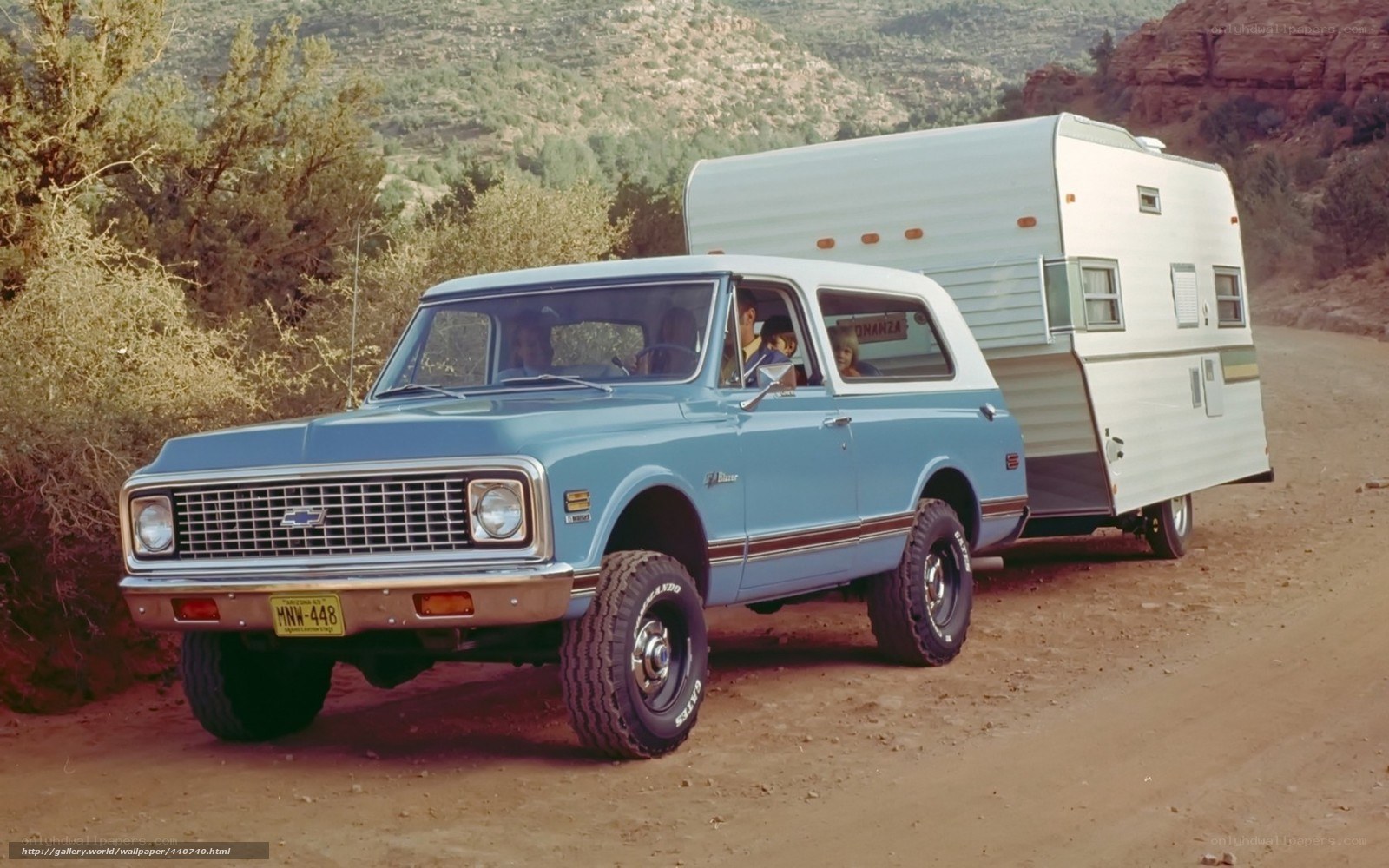Blue truck with camper trailer
