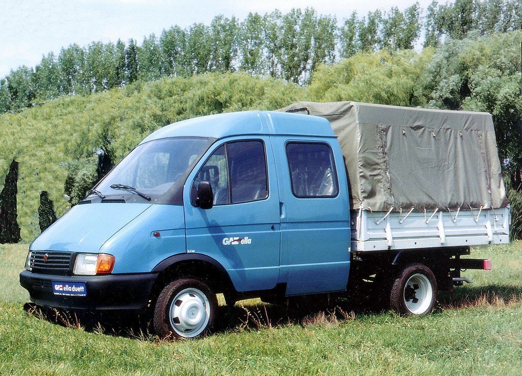 blue truck with cargo cover
