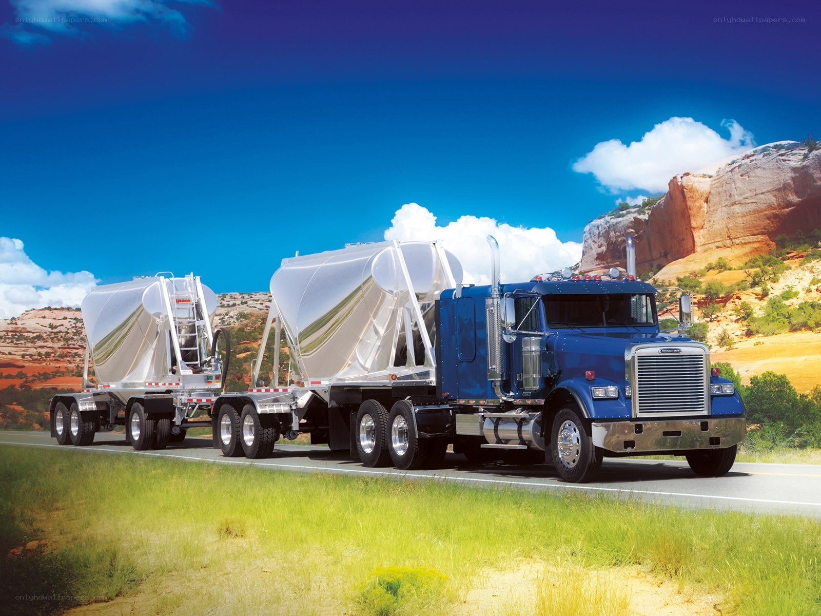 Blue truck with tank trailers