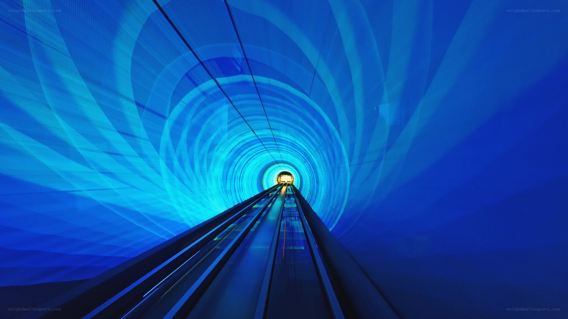 Blue tunnel with light at end