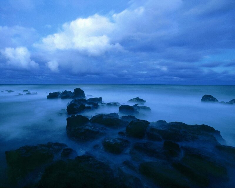 Blue twilight at the rocky shore