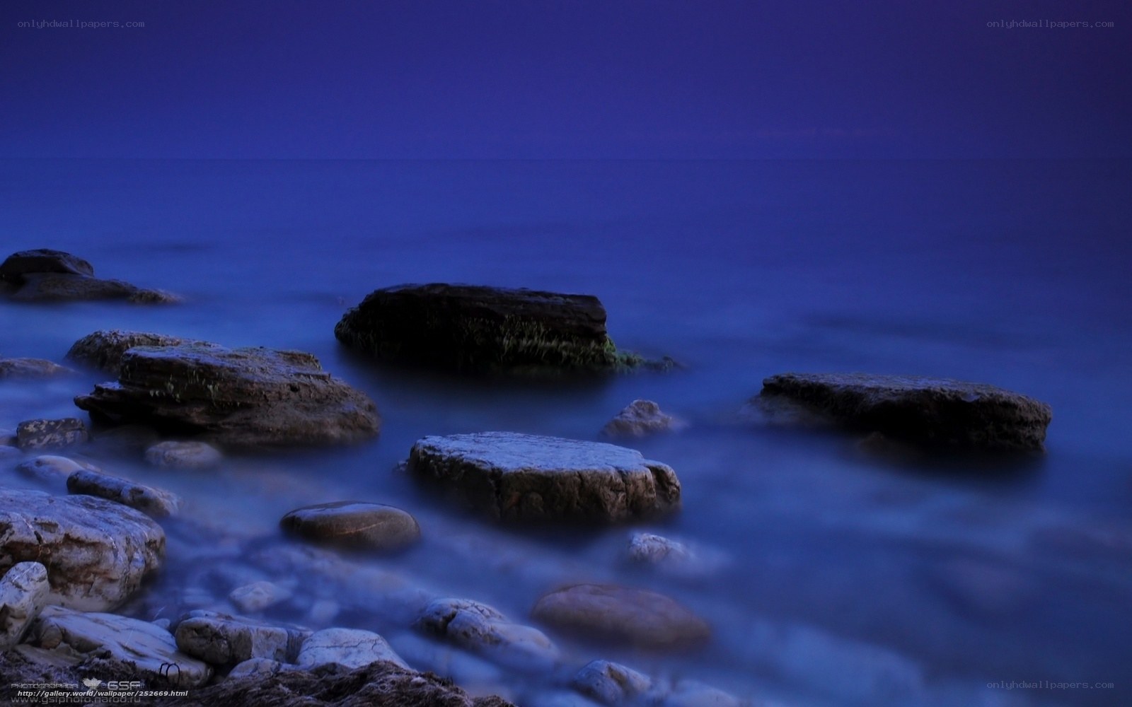 Blue twilight at the rocky shore