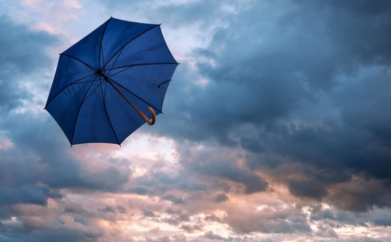 Blue Umbrella in Sky