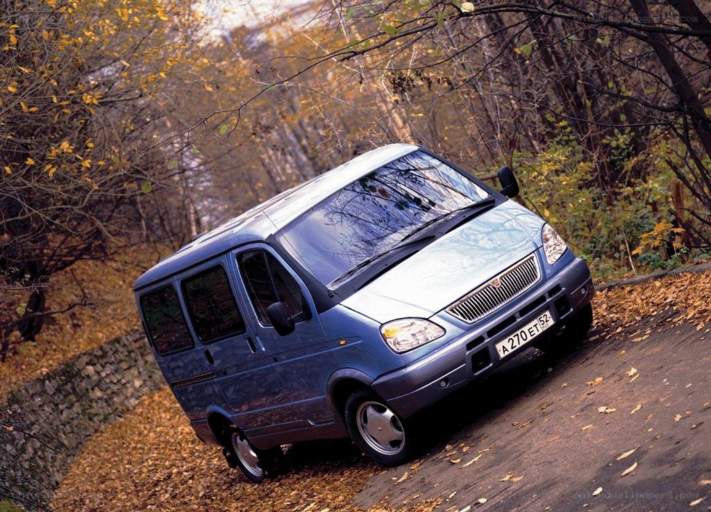 Blue van on autumn road