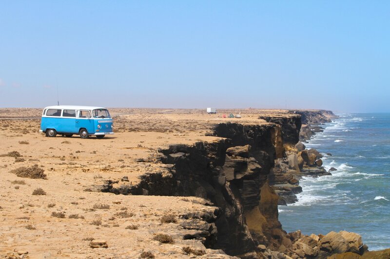 Blue Van on Cliff