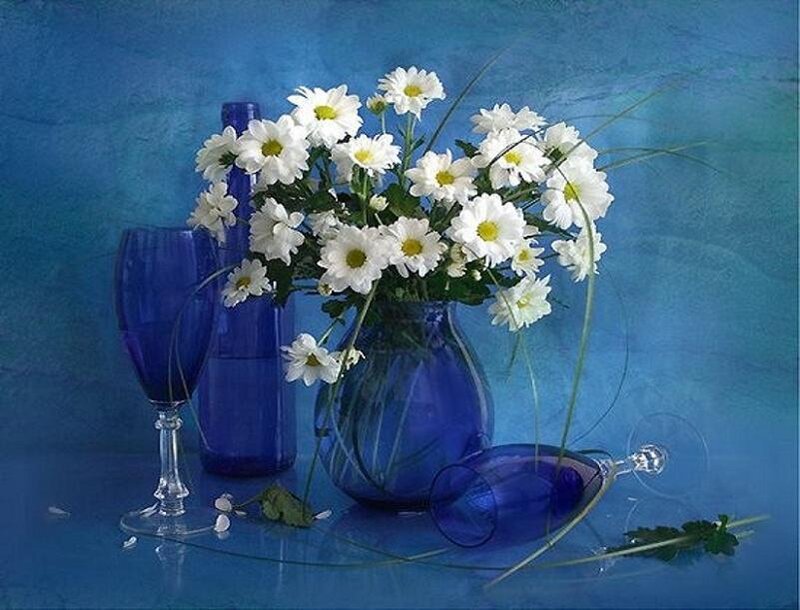 Blue vase with white flowers