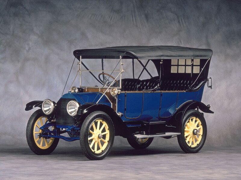 Blue vintage automobile with convertible top