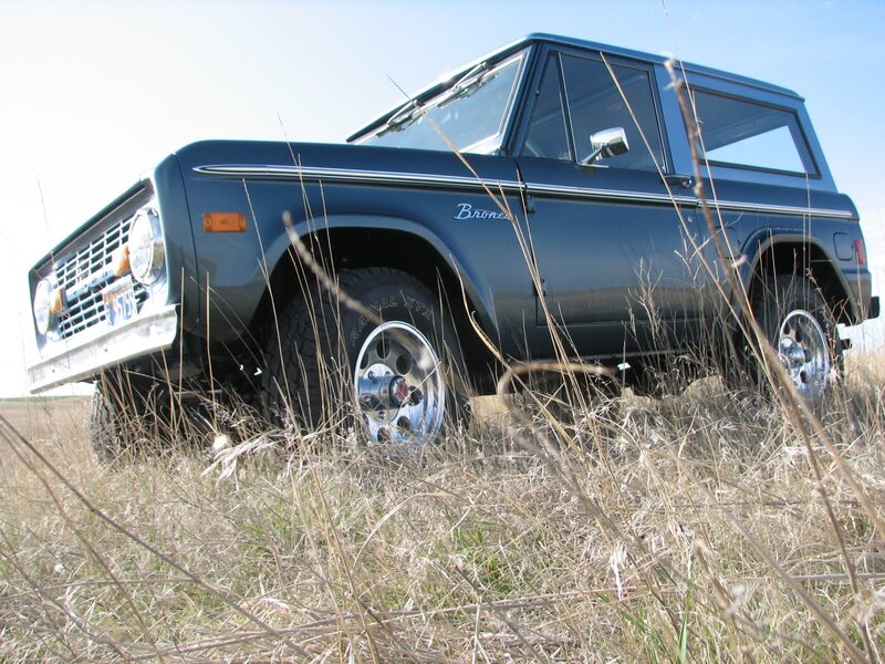 Blue vintage Bronco in grass