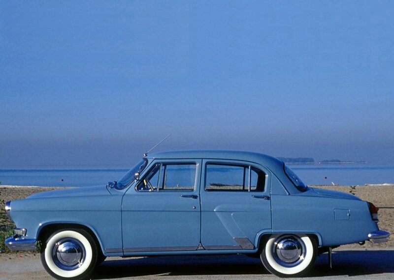 Blue vintage car by the sea