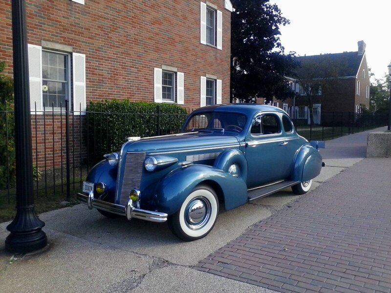 Blue Vintage Car — Calm, Afternoon, Photograph, Brick Building