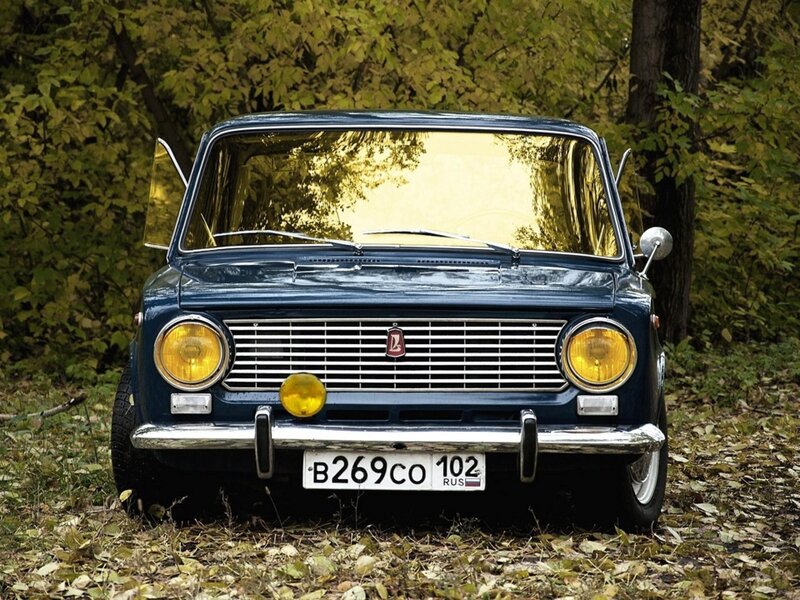 Blue vintage car in forest