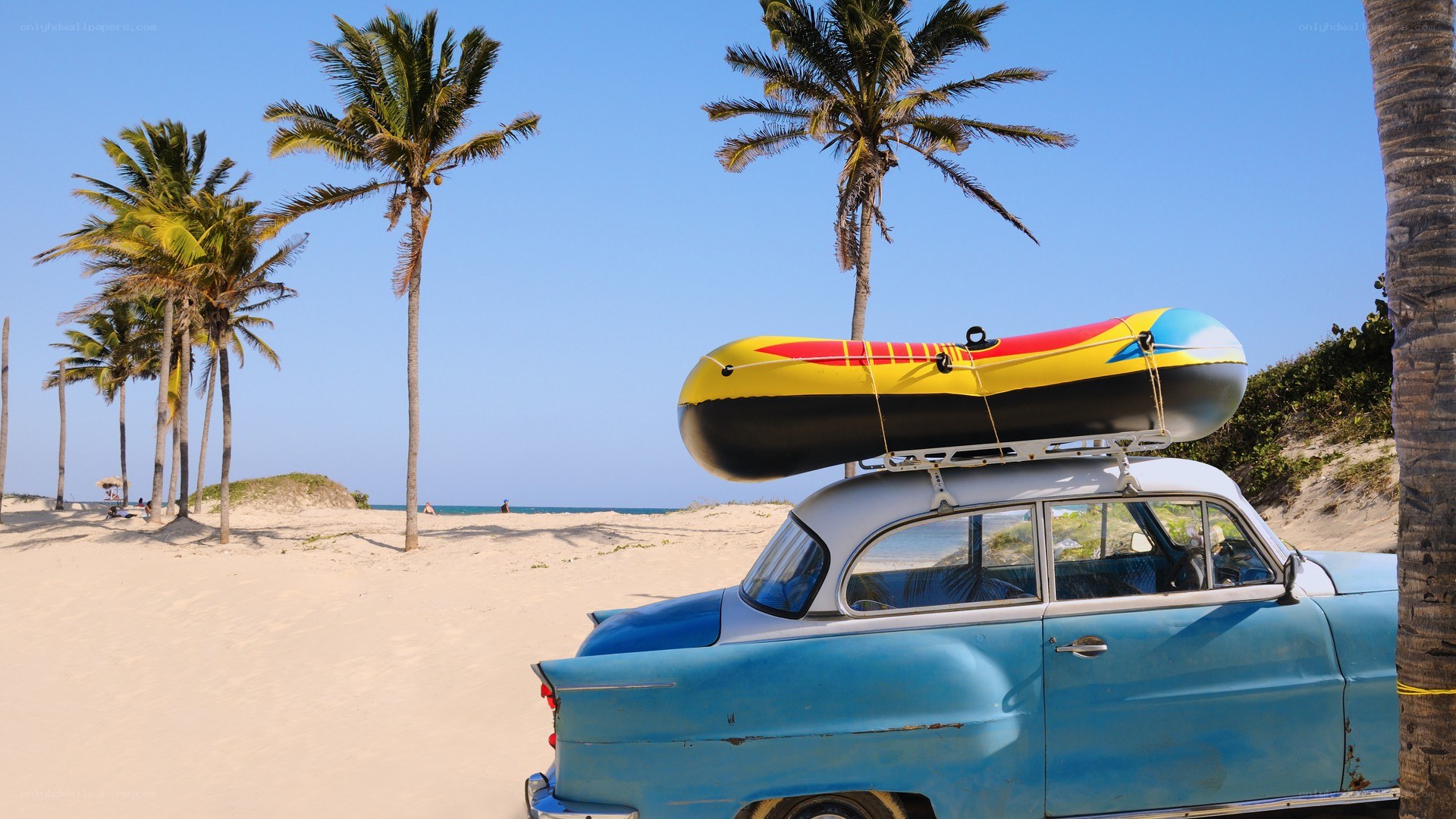 Blue vintage car on beach