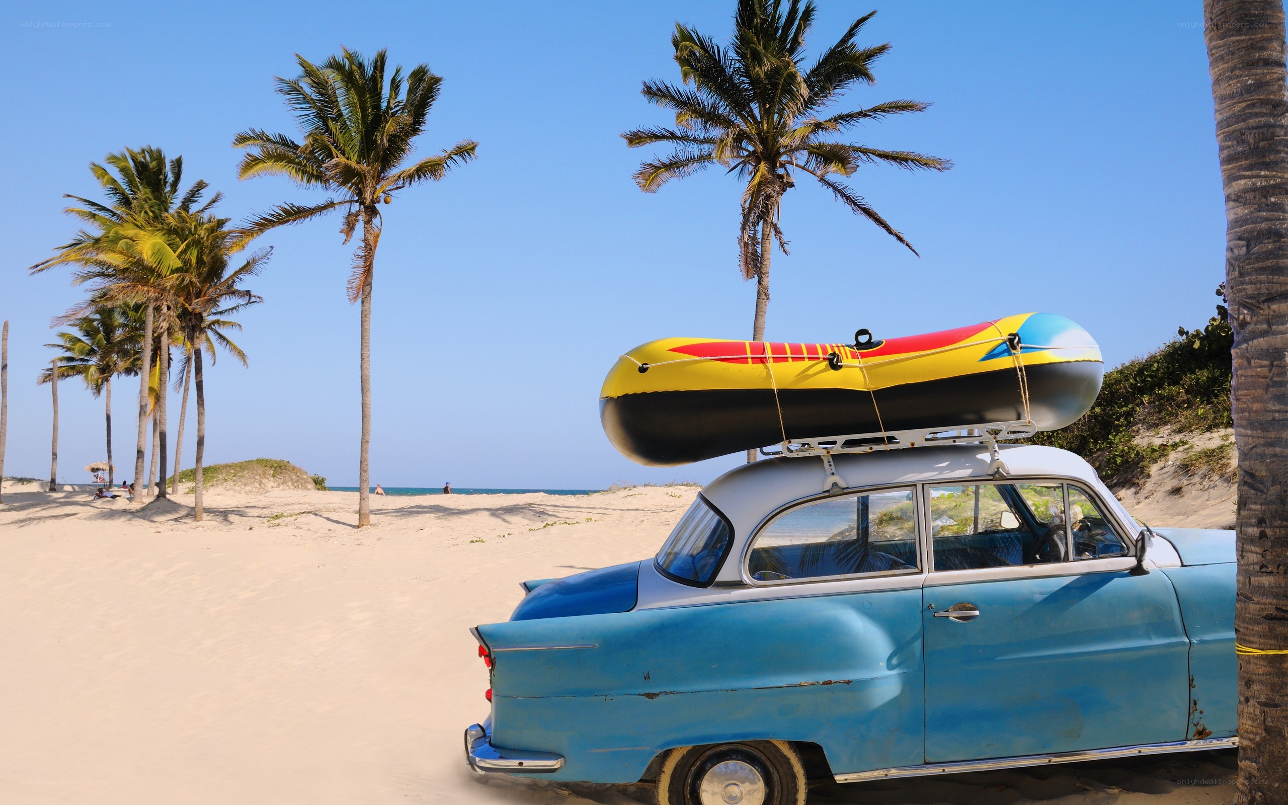 Blue vintage car on beach