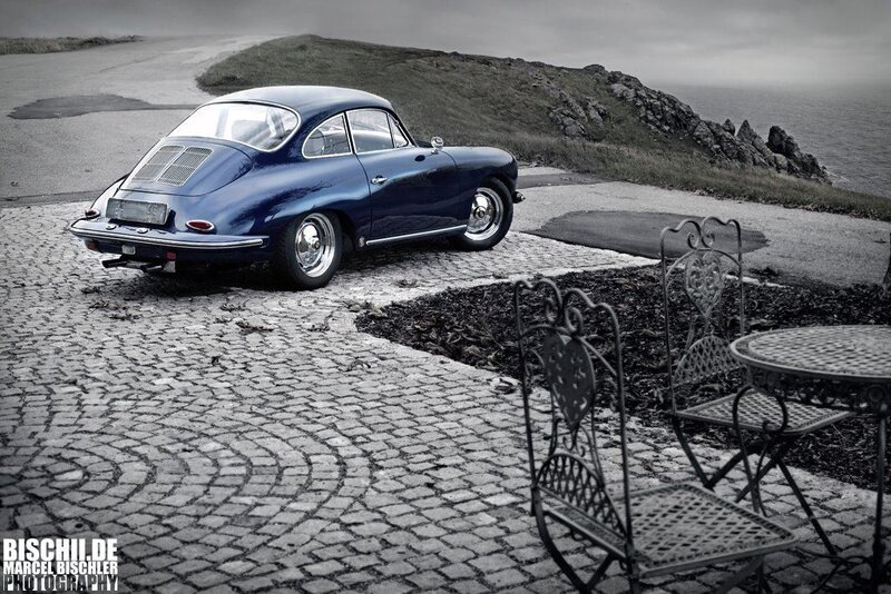 Blue vintage car on cobblestone