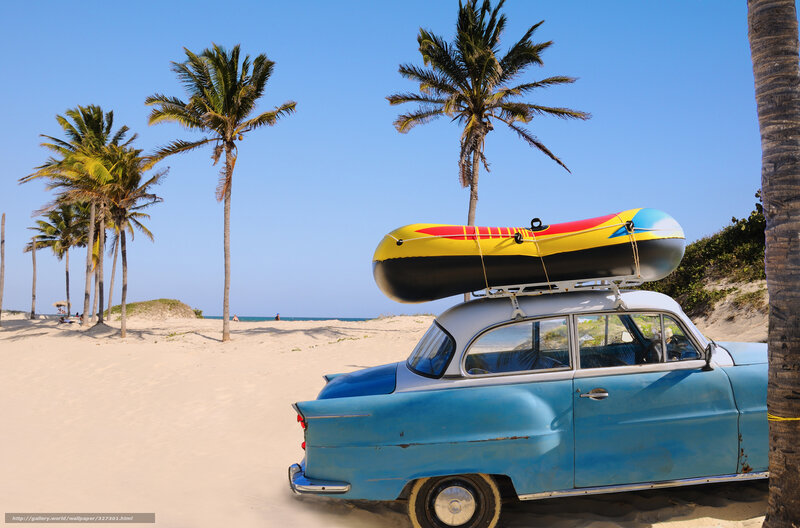 Blue vintage car on tropical beach