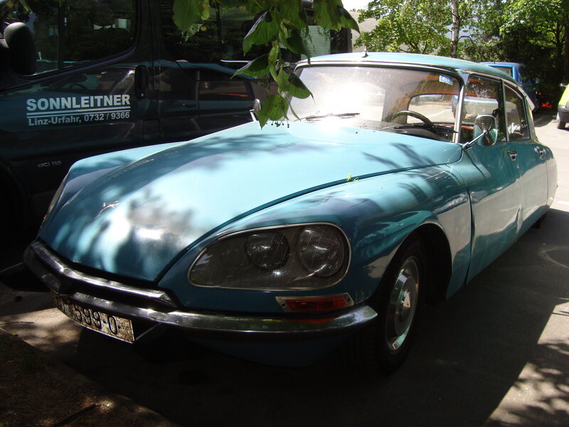 Blue vintage car parked outside