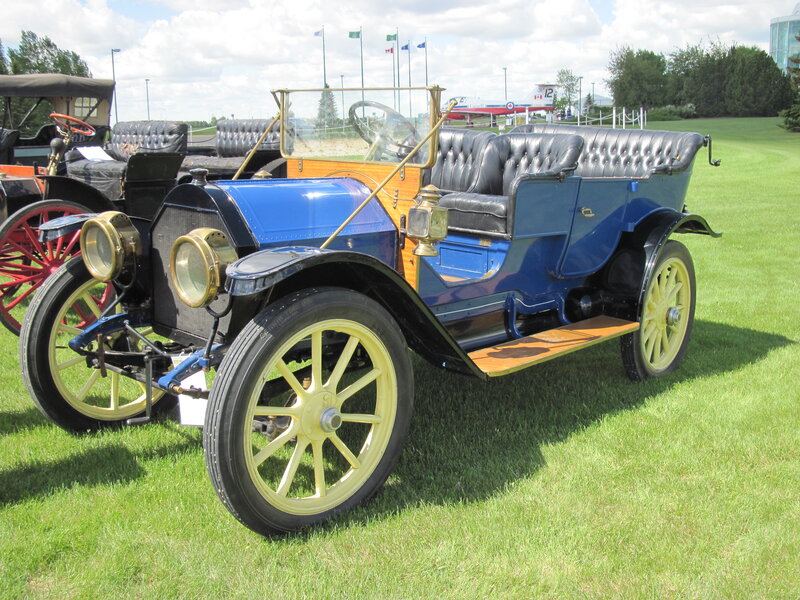 Blue Vintage Car — Serene, Afternoon, Photograph, Grass, Airplane
