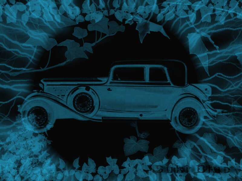 blue vintage car with ivy