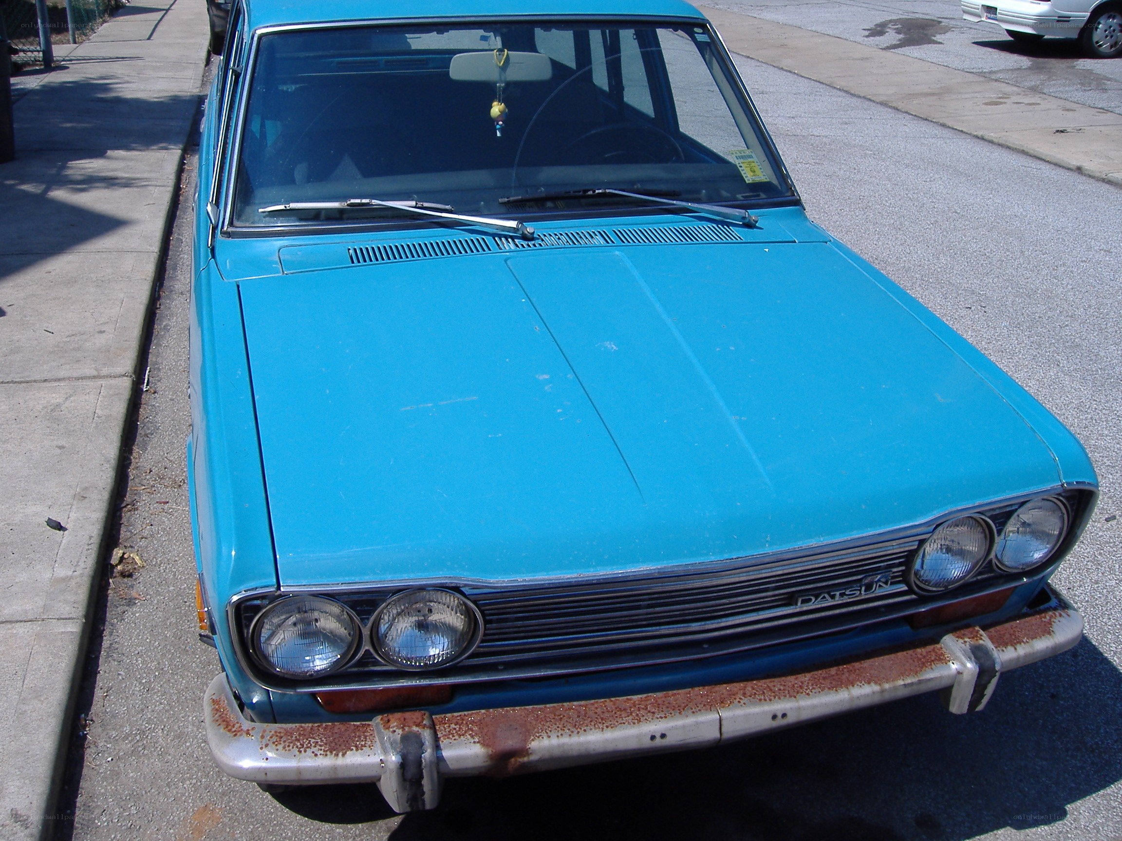 blue vintage datsun car