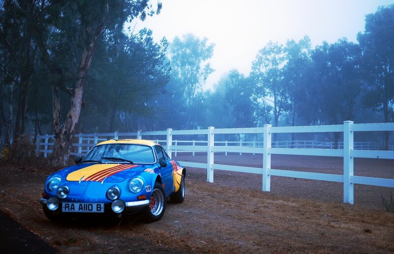Blue vintage race car in fog