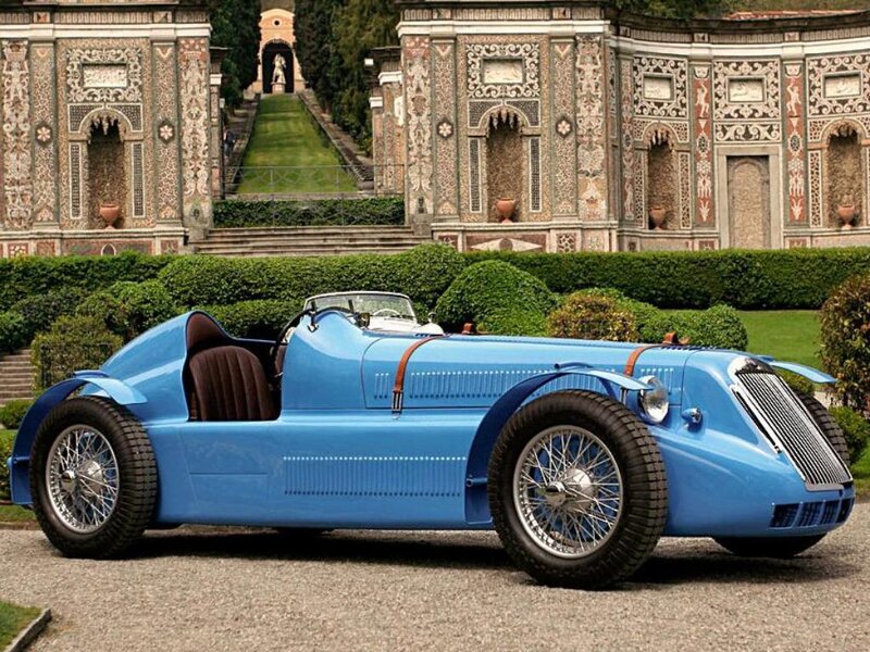 Blue vintage race car in garden