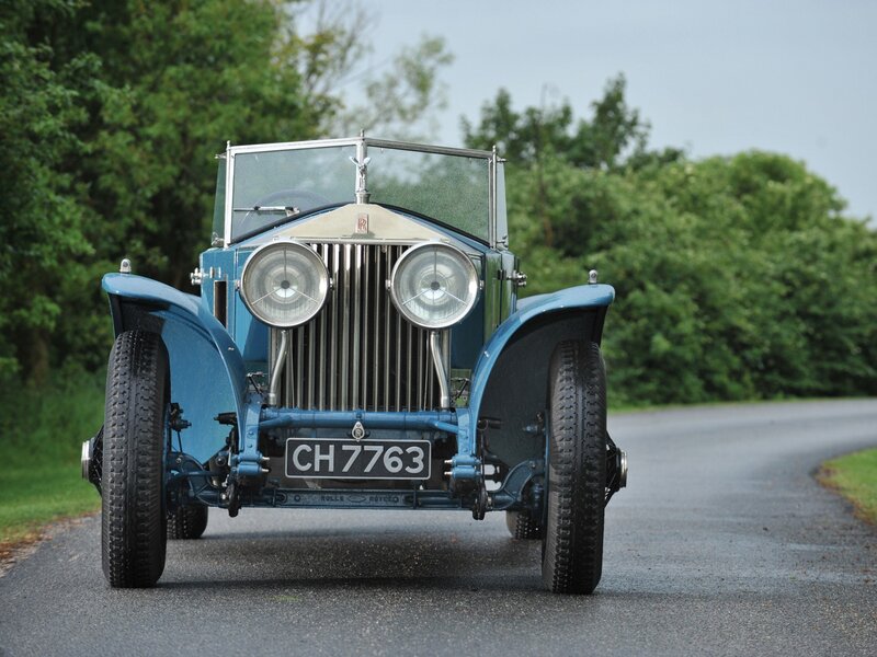 Blue vintage Rolls-Royce on road