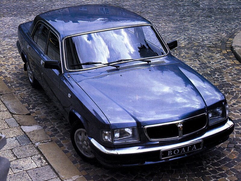 Blue Volga sedan on cobblestones