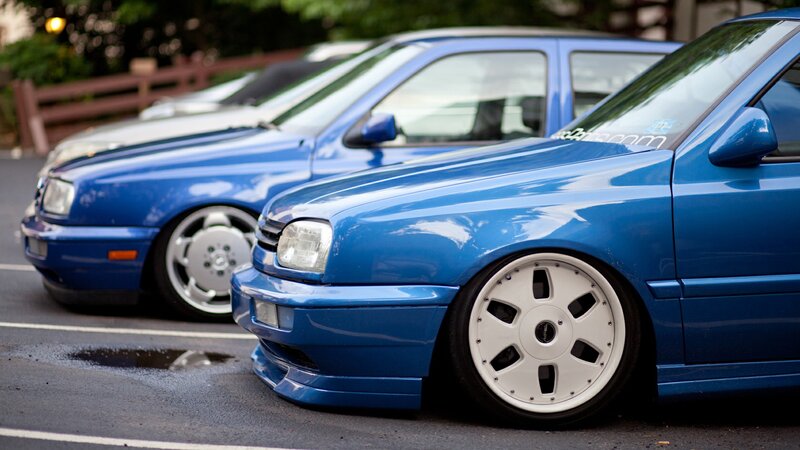 blue volkswagen cars in parking lot
