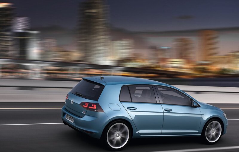 Blue Volkswagen Golf in motion