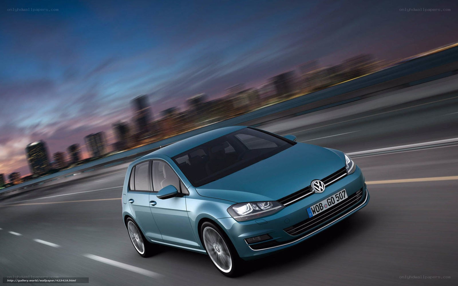 Blue Volkswagen Golf in motion