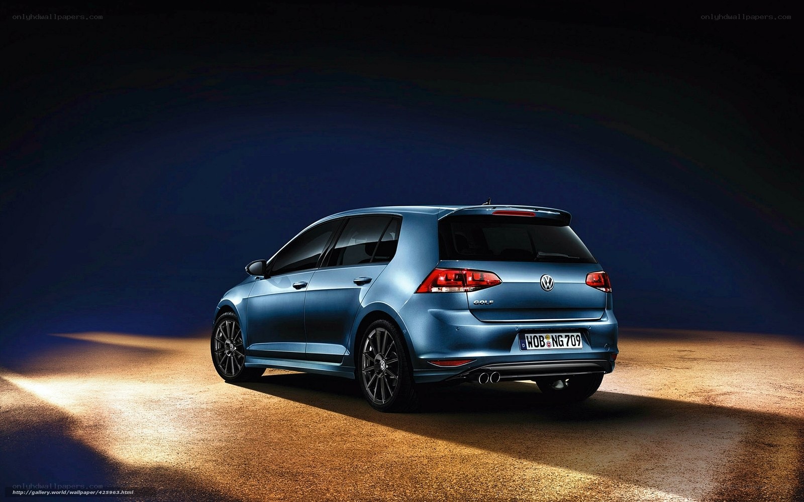 Blue Volkswagen Golf in studio
