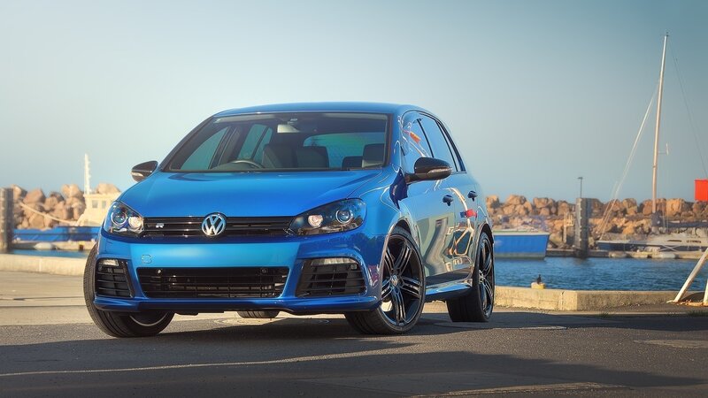 Blue Volkswagen Golf R at the harbor