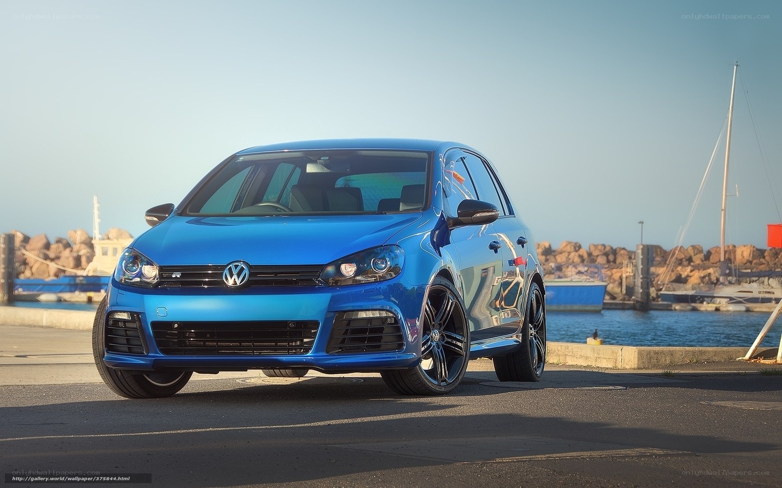 Blue Volkswagen Golf R at the harbor