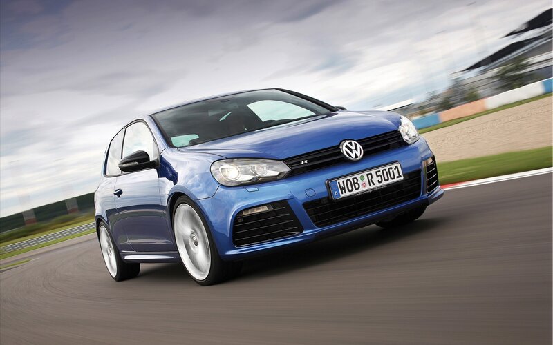Blue Volkswagen Golf R on a racetrack
