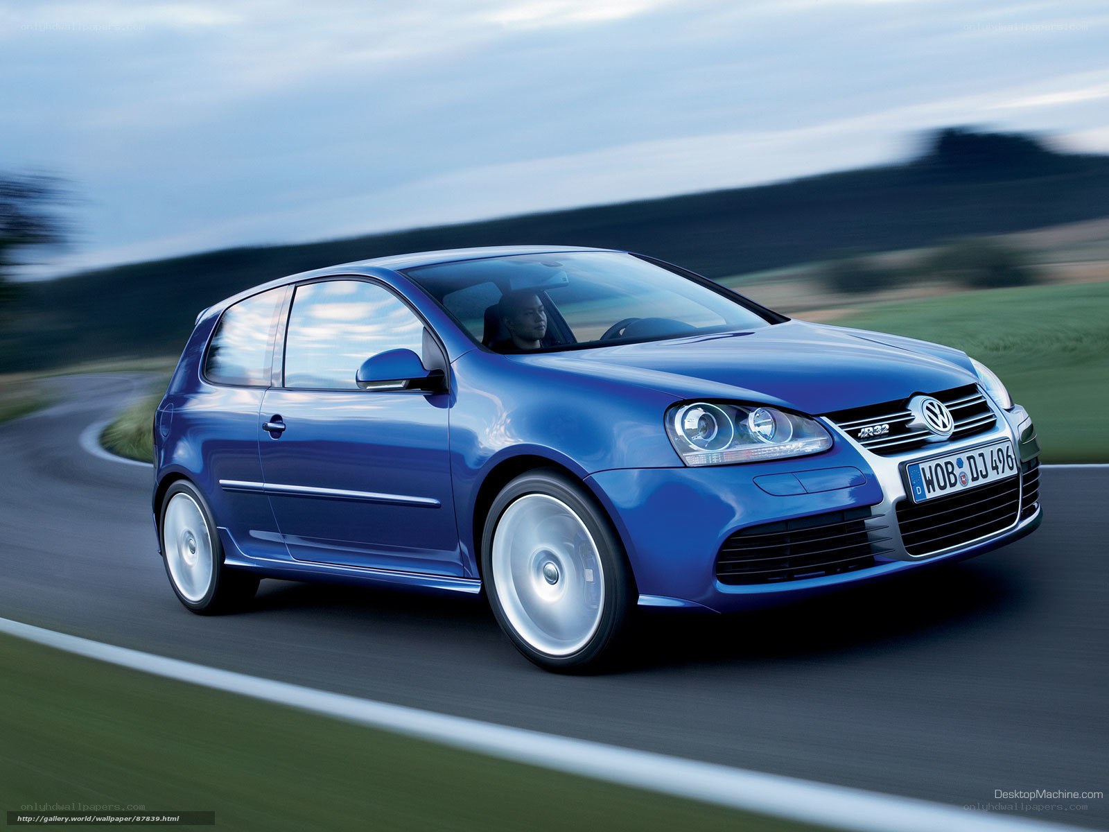 Blue Volkswagen Golf R32 in motion
