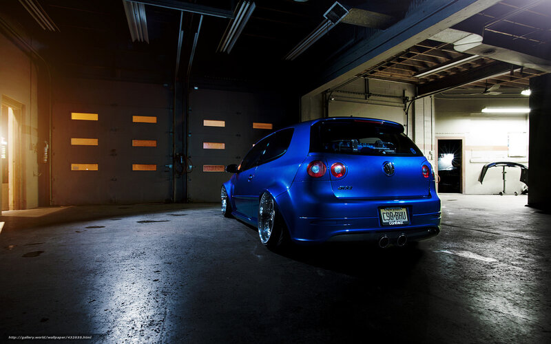 blue volkswagen in garage