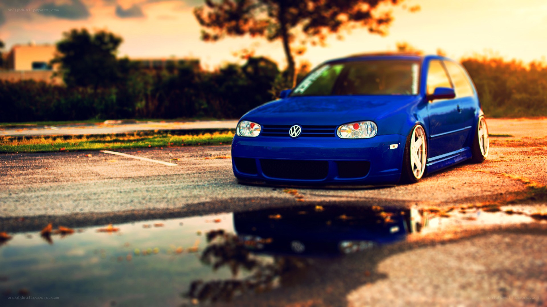 blue volkswagen in sunset