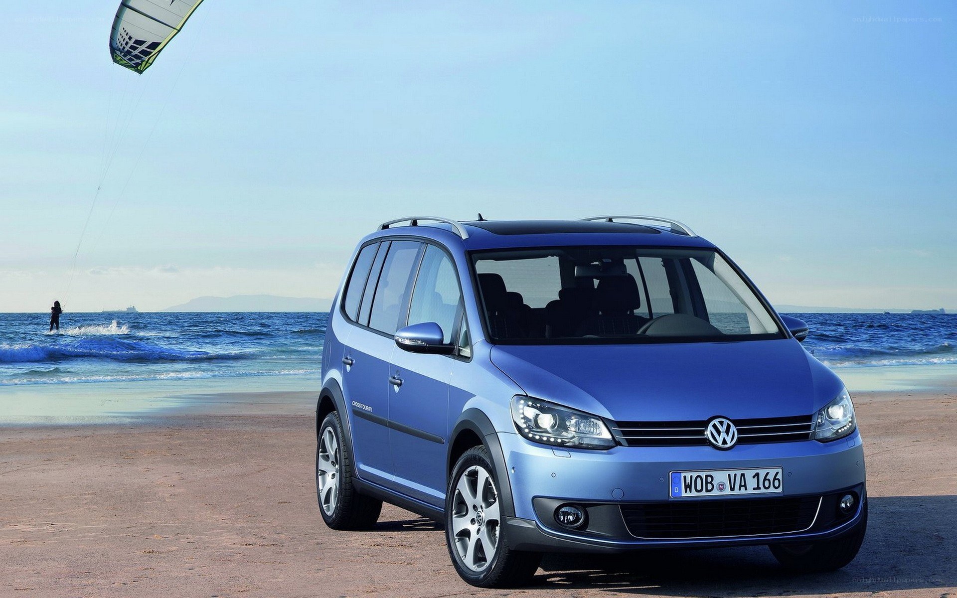 Blue Volkswagen on a beach